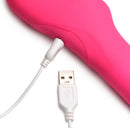 Close-up of the Strap U 30X Thrusting Vibrating Strapless Strap-On Pink charging with USB cable.