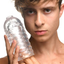LoveBotz Milker Masturbator Accessory Clear Stroker Sleeve held by a young person, showcasing its transparent design.