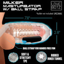 LoveBotz Milker Masturbator with Ball Strap Clear, featuring ribbed inner tunnel and soft TPE design for hands-free pleasure.