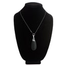 10X Vibrating Silicone Teardrop Necklace displayed on a jewelry stand, showcasing its sleek design and premium materials.