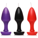 Master Series Kink Inferno Butt Plug Drip Candles in purple, black, and red for sensual wax play.
