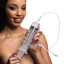 CleanStream Enema Syringe with Tube 300ml Clear held by a person, showcasing clear measurement markings and a smoothly tapered tip.