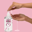 Liquid Passion Natural Water Based Lubricant 16 Oz being dispensed onto a hand for smooth application.