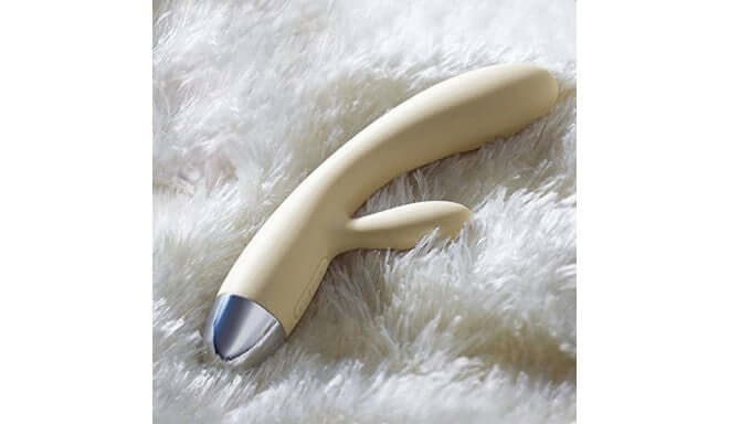 Alice Rabbit Vibrator Khaki by Svakom, a sleek silicone sex toy on a soft surface.