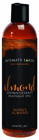 Intimate Earth Almond Massage Oil 4 Oz in a bottle, featuring honey almond scent for soothing massage and relaxation.