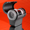 Playboy Come Along Travel-Sized Stroker showcasing dual entries and sleek design for on-the-go pleasure, displayed against a vibrant orange background.