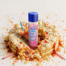 Skins Birthday Cake Water Based Lubricant 4.4 Fl Oz bottle surrounded by colorful birthday cake and sprinkles.