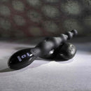 Black flexible beaded vibrator with digital controls on stone background designed for intense backdoor play