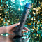 Evolved Black Thunder internal massager with beads, remote control, and suction cup base held by a hand.