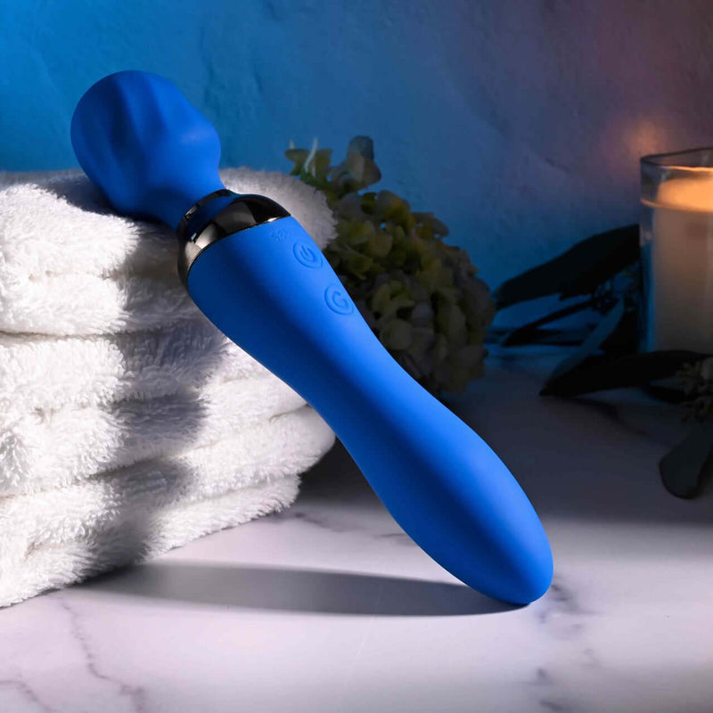 Selopa Blue Belle Double-Ended Vibrator with Dual Motors and 7 Speeds on towel, providing versatile pleasure
