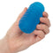 Hand holding Pop Sock!™ Ribbed Blue reversible masturbator showcasing its ribbed texture for varied sensations