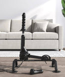 Fetish Fantasy Body Dock Pro Sex Machine with adjustable thrusting power and multi-speed control in black, in front of a sofa.