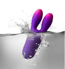 Glo Girl Bunny Vibrator Pink Purple submerged in water, showcasing its waterproof design and flexible bunny tips.