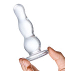 Hand holding a Glass Butt Plug 4 Inches featuring a smooth, graduated design for pleasurable stimulation.