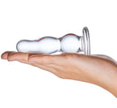 Glass Butt Plug 4 Inches being held in a hand, showcasing its smooth design and stylish craftsmanship.