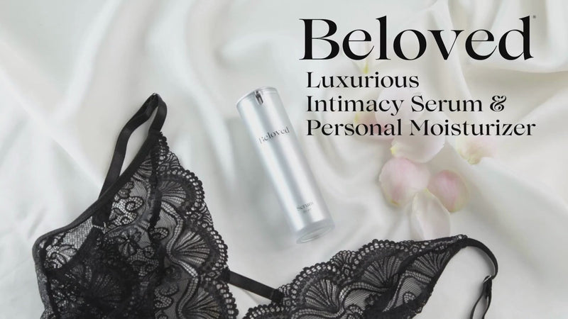 Beloved Luxurious Intimacy Serum 15 ml beside black lace lingerie and flower petals.