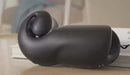SVibe Snail Evo Rechargeable Masturbator Black resting on a table, showcasing its ergonomic design.