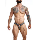 Male Basics Dngeon Chain Jockstrap Camo One Size showcased on a muscular model with tattoos.