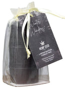 Earthly Body Hemp Seed 3-in-1 Massage Candle Holiday Trio gift set with festive packaging and tags.