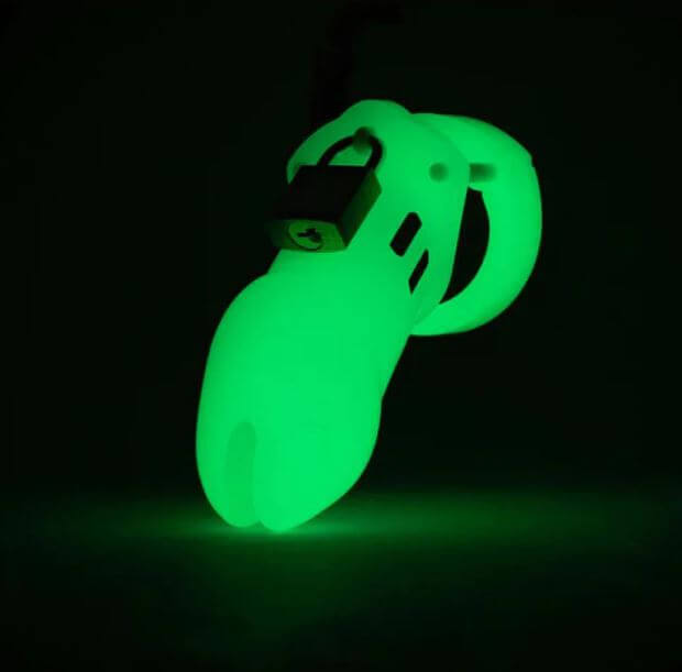 CB-6000 Glow-in-the-Dark Chastity Kit 3.25" Cage, Locktober 2024 Edition, illuminated in the dark showing its unique glow.