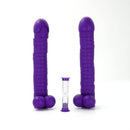Purple penis-themed party game pieces from PLAY WIV ME Cock Tower with an hourglass timer for hilarious adult gatherings.