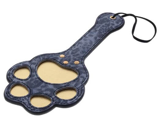 Blue leopard faux leather paddle with paw-shaped cutouts for playful marking and stimulating sensations.