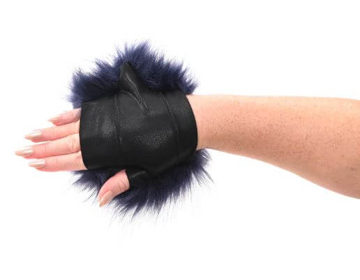 Blue faux fur sensory glove with hidden gold spikes on hand, featuring luxurious design for playful exploration and tactile sensations.