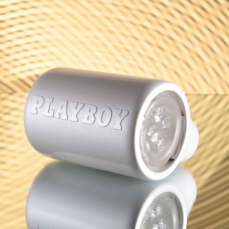 PLAYBOY Spin Doctor - Dual Entry Spinning Stroker with 7 Speeds in sleek black and pearl finish with texture nubs for perfect thrust.
