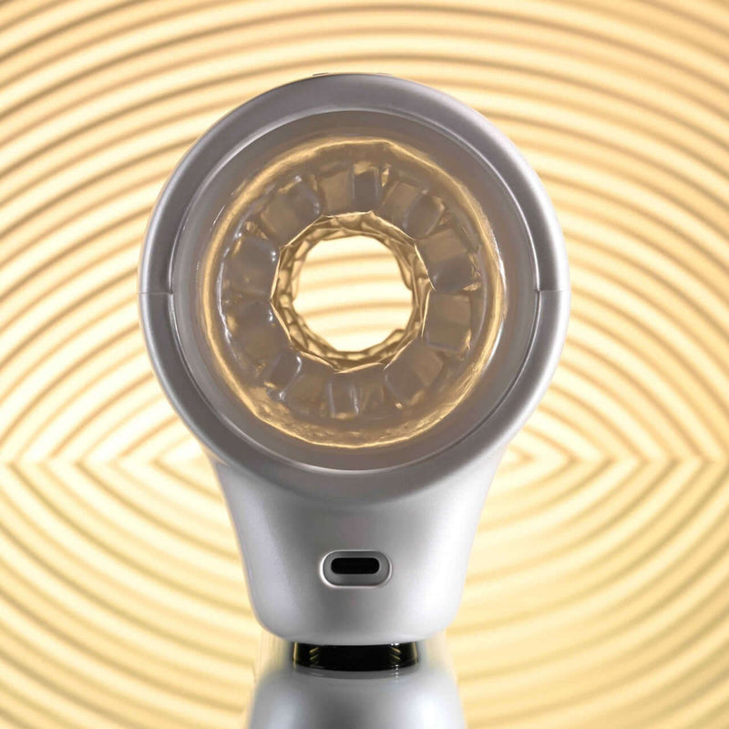 Playboy Spin Doctor Dual Entry Spinning Stroker with 7 speeds and textured nubs, showcasing sleek black and pearl finish.