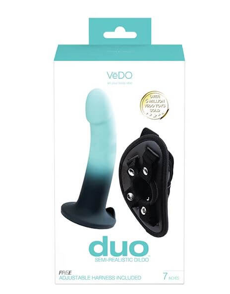 Duo Silicone Dildo with Harness in packaging, featuring 7-inch turquoise and black semi-realistic dildo and adjustable black harness.