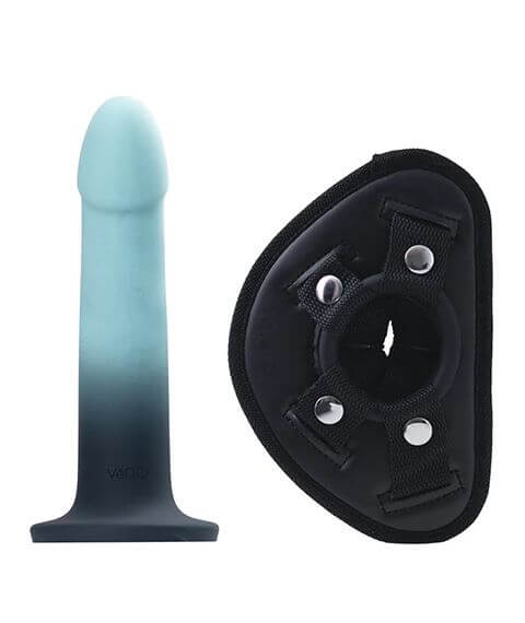 Turquoise silicone dildo and black harness for versatile pleasure and secure fit.