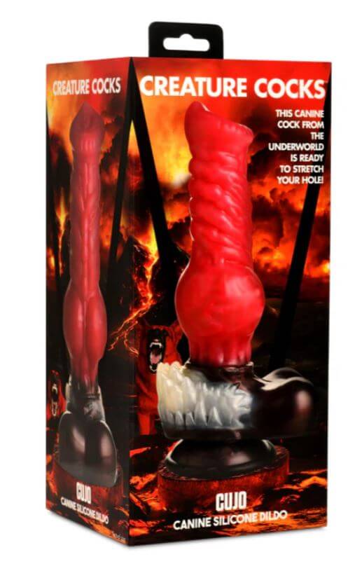 Creature Cocks Cujo Canine Silicone Dildo in packaging with red shaft, ropey ridges, and suction cup base. Fantasy dog dildo.