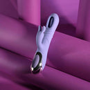 Playboy Tap Me In Rabbit Vibrator Lilac displayed against a vibrant purple background.