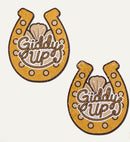 Giddy Up Sparkling Horseshoe Golden Nipple Covers with shimmering gold finish and rope-inspired lettering.