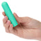 Hand holding Turbo Buzz™ Rounded Bullet Green compact powerful discreet stimulator.