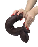 Get Lucky Real Skin 12 Inch Dual Layer Dildo Dark Brown being held, showcasing its lifelike design and dual-layer technology.