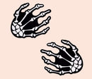 Pastease Skeleton Hands Glow-in-the-Dark Pasties, fun and flirty Halloween accessory for parties or playful nights, black and white design.