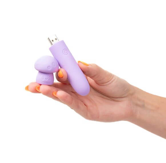 Compact HAPPI Silicone Mini Vibe with USB connector shown in hand, travel-friendly and body-safe.