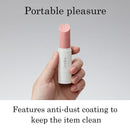 Tenga Iroha Stick Lipstick Vibrator Light Pink in hand, showcasing its sleek design and anti-dust coating.