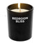 Bedroom Bliss Lover's Vanilla Scented Massage Candle in a black jar with a lit wick