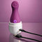 Purple Playboy Jet Set Tapping Toy with Self-Charging Case for clitoral stimulation on a pink background