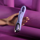 Playboy Tap Me In Rabbit Vibrator Lilac in hand, showcasing its dual-action design and soft lilac color.