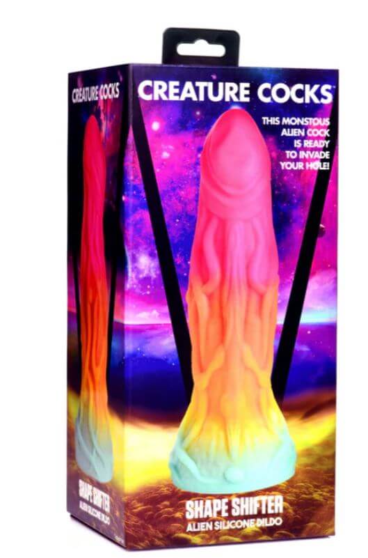 CREATURE COCKS Shape Shifter Alien Silicone Dildo in vibrant rainbow colors displayed in its packaging.