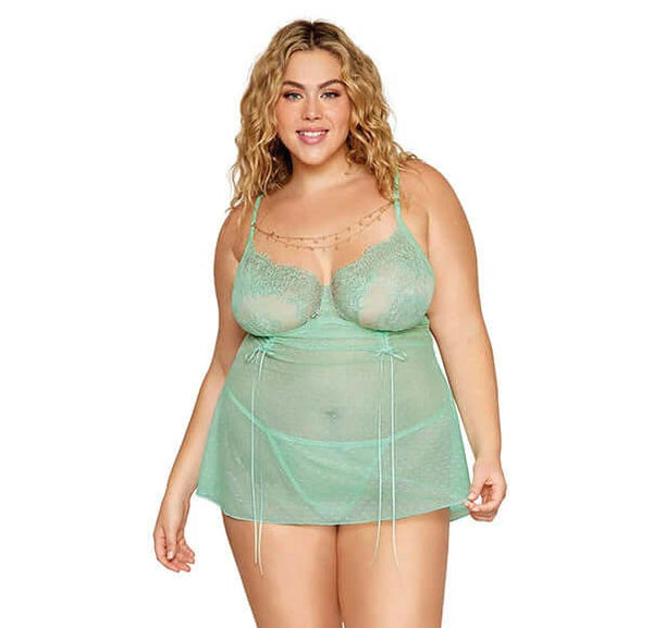 Woman wearing Eyelash Lace Babydoll Set in Seafoam with delicate gold chain and butterfly charm, adjustable straps, and matching G-string.