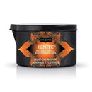Kama Sutra Ignite Massage Candle Tropical Mango in a stylish black container.