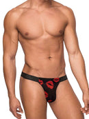 Man wearing Male Power low-rise Kiss Me Micro Thong with lips print design.