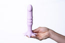 Maia Dazey Cannabis Leaf Silicone Dong Purple held in hand, showcasing its pastel color and unique design.
