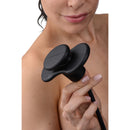 Master Series Inflatable Silicone Butterfly Gag Black held by a model, showcasing its unique design for oral restraint play.