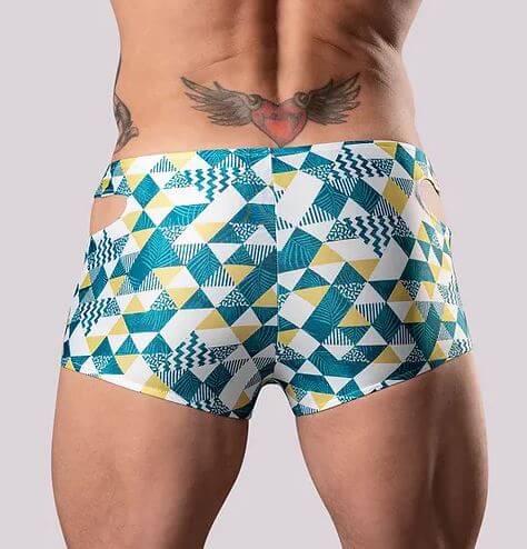 Vibrant geometric patterned men's mini shorts with laser-cut sides, designed for bold summer fashion and comfortable support.