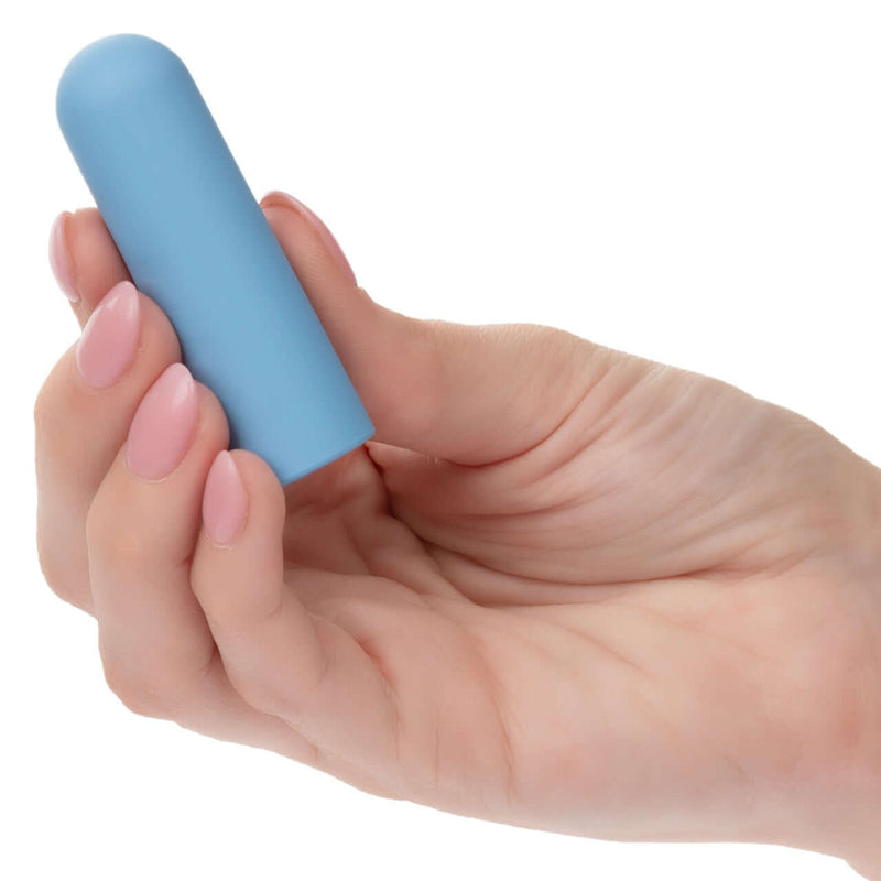 Hand holding blue Turbo Buzz Round Mini Bullet stimulator for discreet, powerful pleasure with 10 functions, body-safe, waterproof design.